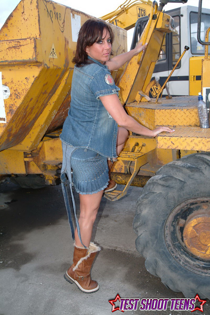 Horn construction worker in boots strips down to her underwear on the worksite