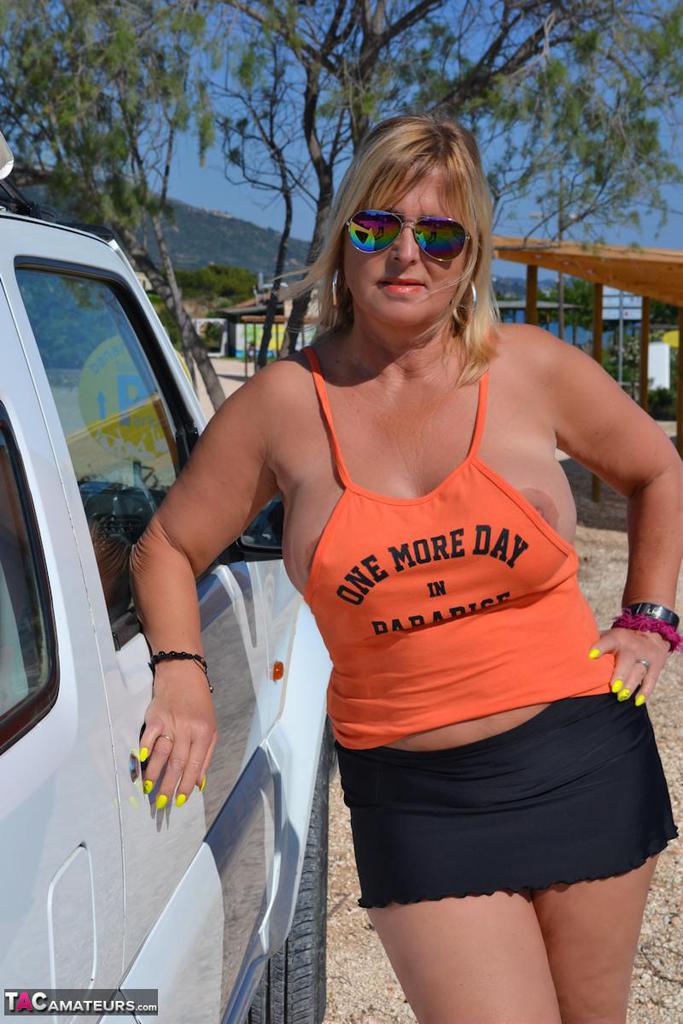 Slutty mature nudist with large tits Chrissy shows her hot curves at the beach Slutty mature nudist with large tits Chrissy shows her hot curves at the beach