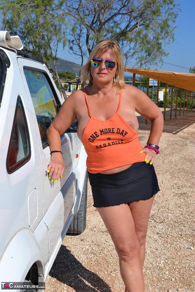 Slutty mature nudist with large tits Chrissy shows her hot curves at the beach Slutty mature nudist with large tits Chrissy shows her hot curves at the beach